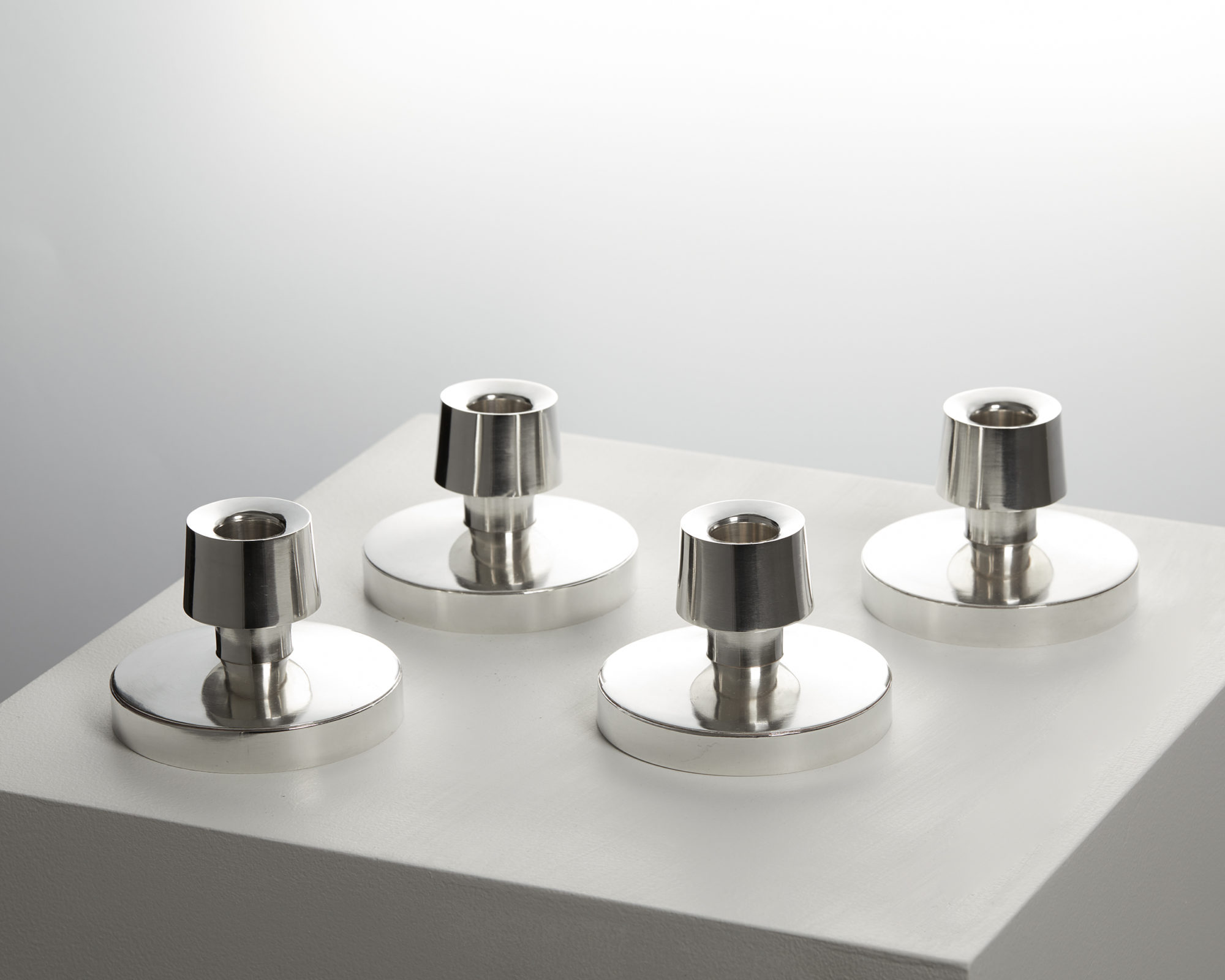 Set of four candlesticks, designed by Rey Urban, — Modernity
