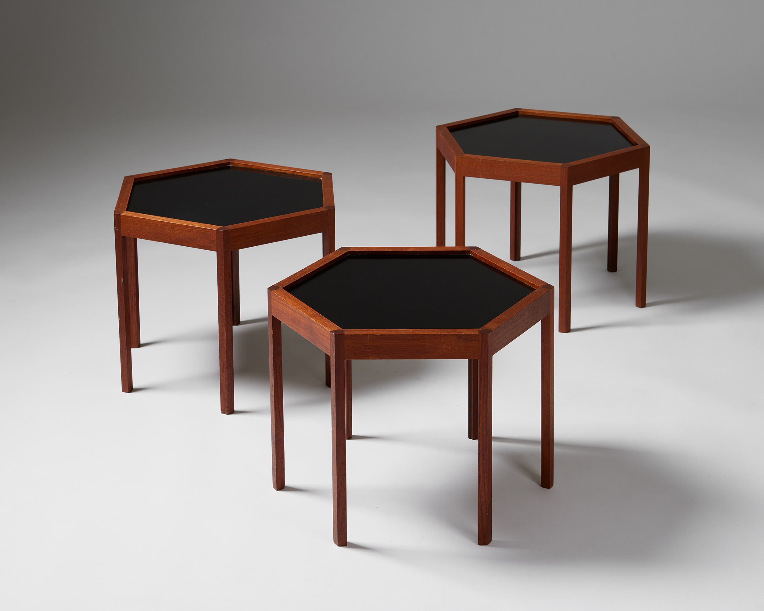 Set of three hexagonal side tables designed by Hans C. Andersen, — Modernity